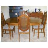 Dining room table, leaf, 4 cane back chairs, 1 capt. cane leaf chair