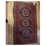 Antique Oriental carpet 5x3 ft. Colors of red, blue, white, brown, and white fringe.