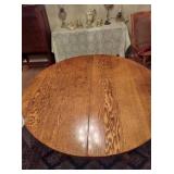 Round pedestal game table in Cottage Oak 44” Round. Wood. Beautifully Carved Legs.