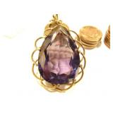 Flame Fusion Synthetic Alexandrite like Sapphire weighing 90 carats and set in 14kt rose gold. 