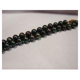 Peacock black pearls