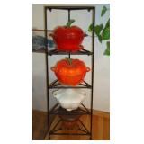 Kitchen casseroles on iron, metal stand