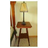 Antique parlor table with stained glass lamp