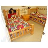 Rustic log twin beds with nightstand