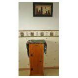 Drop down ironing board with storage