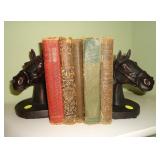 Decorative horse bookends and vintage books