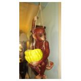 Ceramic hanging monkey on a swing