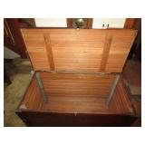 Inside of large wooden blanket chest, trunk