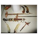 Antique peace pipes, antique war clubs