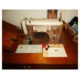 Lady Kenmore Sewing machine in cabinet