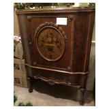 Antique Storage Cabinet with Inlaid Wood Front Panel and Carved Relief   