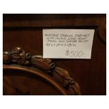 Antique Storage Cabinet with Inlaid Wood Front Panel and Carved Relief   