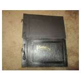 Old fashioned photo album with antique photos.