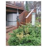 Dual shepards hooks and bird feeders.