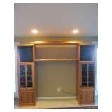 Adjustable Oak Entertainment Center with spot lighting.  97"wide x 17"deep x 81.5"high