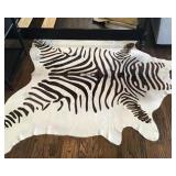 Cowhide zebra print area rug 72”x 90” Full price $250.00; if interested call (314) 805-6219  