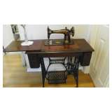 Early Singer Sewing Machine in original wood case with cast iron foot treadel