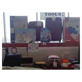 Assorted luggage, stereo system, VCR, various dumbbell weights, pillows, towels