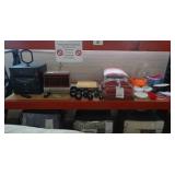 Stereo system, VCR, various dumbbell weights, pillows, towels