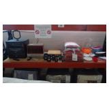 Stereo system, VCR, various dumbbell weights, pillows, towels