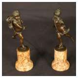 bronze figures on marble bases