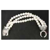 three strand pearl bracelet with tiger like cat clasp 