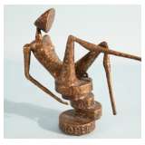 Reclining figure metal sculpture signed