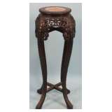 carved plant stand