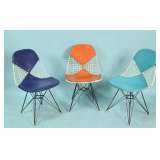 three mid century modern chairs