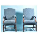pair of blue upholstered armchairs 