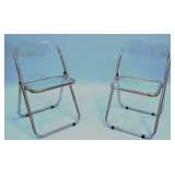 pair of clear folding chairs 
