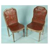 pair of painted leather chairs with wood frame