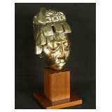 brass sculpture mounted on wood base
