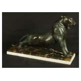 bronze lion on marble base