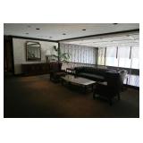 many mirrors, leather sofas, leather chair