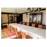 large breakfront, many chandeliers, dinning table and many styles of side chairs