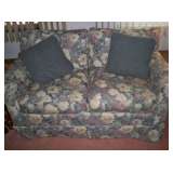 Upholstered floral love seat