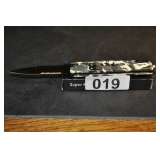 SUPER LONG KNIFE SPRING LOADED (NEW IN BOX) CAMO.(RETAIL VALUE $25)