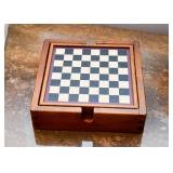 Checkerboard with Various Games Stored Underneath