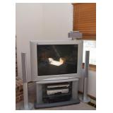 TV, TV Stand, Panasonic Surround Sound System (2 additional floor speakers not shown)