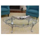 $100 - Oval Glass-Top Cocktail Table with Silver Painted Metal Base (approx. 49.5" L x 28" W x 15"H)