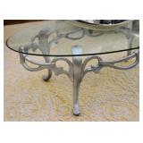 $100 - Oval Glass-Top Cocktail Table with Silver Painted Metal Base (approx. 49.5" L x 28" W x 15"H)