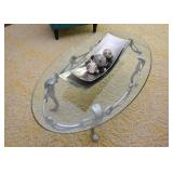 $100 - Oval Glass-Top Cocktail Table with Silver Painted Metal Base (approx. 49.5" L x 28" W x 15"H)