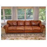 $800 - Leather 4-Seat Sectional Sofa with Nailhead Trim, 2 Pieces (some discoloration and wear)