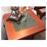 Table has stone inset on top.