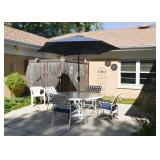 White Metal Outdoor Dining Table (Glass Top), Scroll Arm Chairs with Cushions & Blue Patio Umbrella White Metal Outdoor Dining Table (Glass Top), Scroll Arm Chairs with Cushions & Blue Patio Umbrella