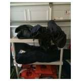 2 camping cots and folding chairs