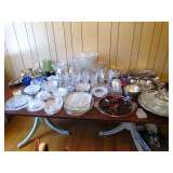 Shabby Chic mahogany dining table loaded with glass ware