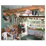 Sun porch full of baskets, garden tools, pots, chairs, fans, lamps, lots of goodies