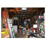 Two car garage loaded with tools and older equipment including antiques